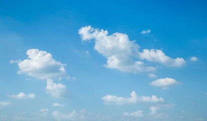 Blue sky with white soft clouds, nature background.