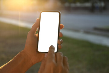 Man using modern mobile phone outdoors, closeup