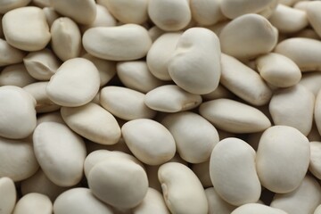 Pile of uncooked white beans as background, closeup