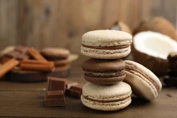 Fotobehang Delicious macarons and chocolate on wooden table © New Africa