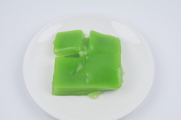 Steamed Layer sweet cake or Khanom Chan Thai traditional dessert (Green Pandan flavour) on white background. Famous desserts in Thailand.