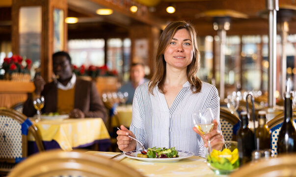 Portrait of a woman who lies in a restaurant hall