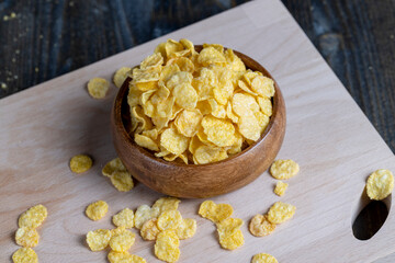 dry breakfast corn flakes of yellow color , close up