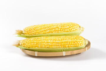 Fresh ripe yellow cobs corn isolated on white background