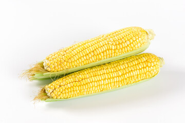 Fresh ripe yellow cobs corn isolated on white background