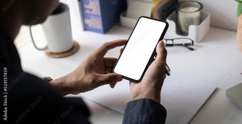 Poster close up view of man holding smart phone. blank screen for your text message or information content.