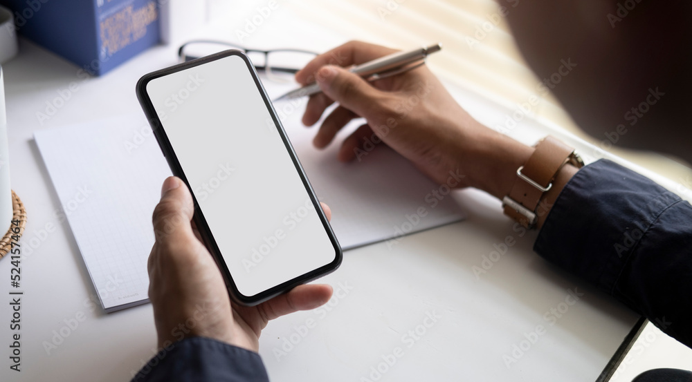 Poster man holding mock up smart phone. blank screen for your text message or information content.