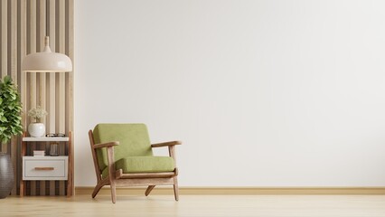 Living room has a green armchair on empty white color wall background.