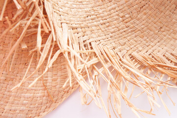 Straw hats with with ragged edges design,  abstract fashion background