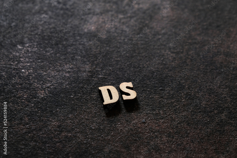 Poster the letters d and sabove the dark field. initials ds