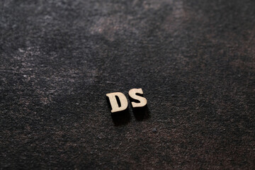 The letters D and Sabove the dark field. Initials DS