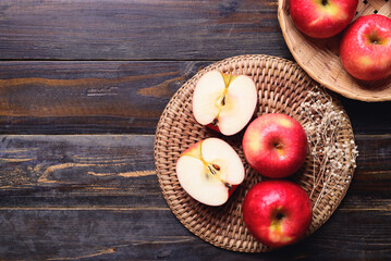 Red apple fruit on wooden background, Table top view