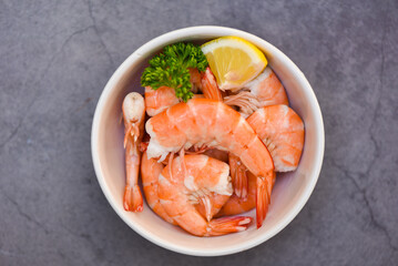 Fresh shrimps served on white bowl, boiled peeled shrimp prawns cooking in the seafood restaurant