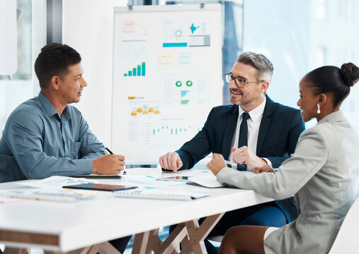 Business meeting, planning and teamwork while sharing idea for financial growth and innovation by marketing team discussing graphs and data in boardroom. Diverse colleagues sharing vision and mission