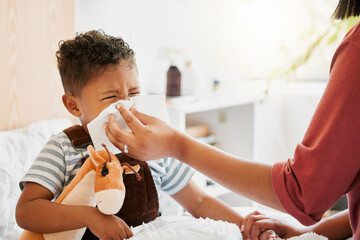 Flu, sick or cold child with parent sneezing, blowing and wiping runny nose while ill with covid...