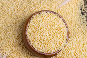 Fresh raw porridge couscous from wheat or millet