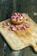 sliced pork sausage and other ingredients on the table