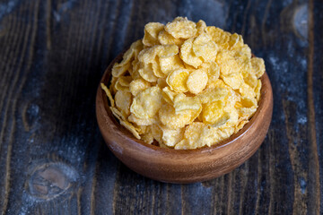 dry breakfast corn flakes of yellow color , close up
