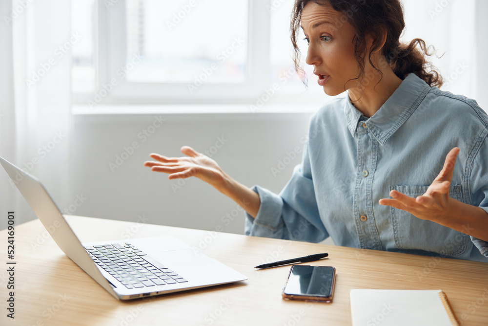 Aufkleber what is happened. confused unhappy beautiful curly woman office worker in perplexity raises hand up 