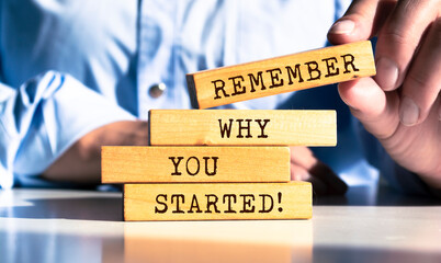 Wooden blocks with words 'Remember Why You Started'.