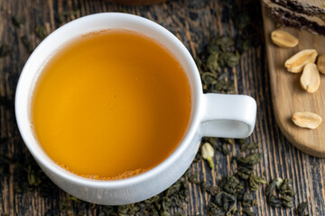 Brewed green tea with jasmine on the table