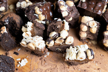 multicomponent cake made of caramel and nuts in chocolate