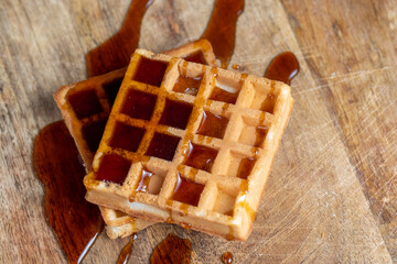 square sweet soft waffles in bee honey