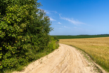 Fototapeta na wymiar Gravel highway in rural areas