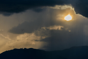 Smog contamination pollution in the mountains of the city of medellin colombia antioquia red and dirt