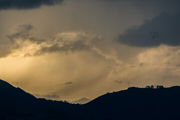 Smog contamination pollution in the mountains of the city of medellin colombia antioquia red and dirt