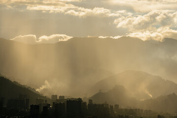 Smog contamination pollution in the mountains of the city of medellin colombia antioquia red and dirt