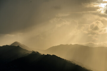 Smog contamination pollution in the mountains of the city of medellin colombia antioquia red and dirt