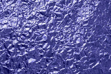 Abstract crumpled foil background, metallic foil texture, metallic foil texture tinted trend color Very Peri
