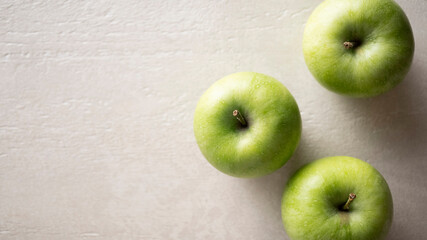Green apples on the table, close up