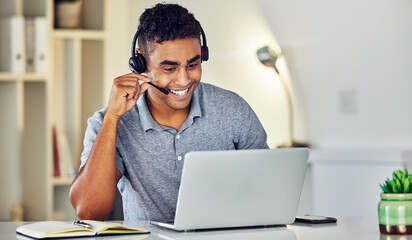 Call center telemarketing agent with headset and laptop working, assisting or talking to online web...