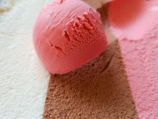 striped pink brown and white neopolitan ice cream