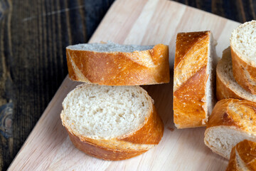 sliced into pieces a long baguette with a crispy crust