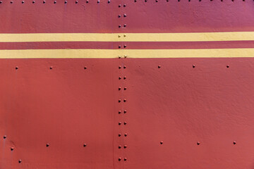 Part of the metal structure of an old steam locomotive