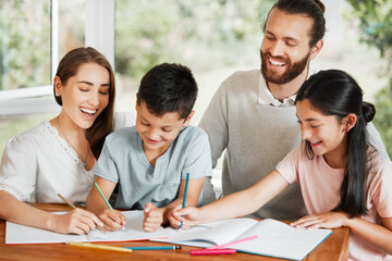 Learning, education and homework with a family writing, drawing and studying together on a table at home. Parents and children bonding and spending time together while feeling happy and carefree