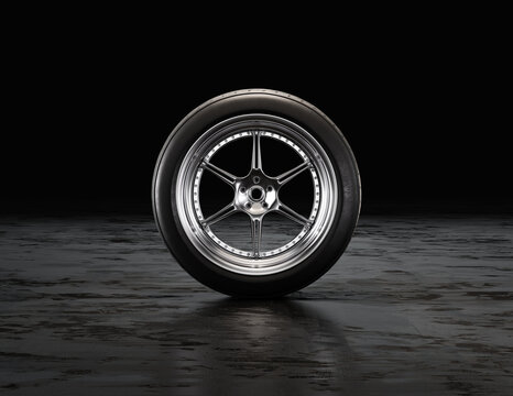 Single Car Tire On A Garage Floor Rubber Wheel With Shiny Chrome Rim. 3d Rendering