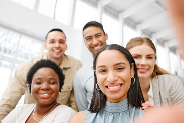 Selfie with fun friends in the office, working together as a team of business people and professional colleagues. Closeup portrait of a diverse corporate group with a mindset and mission of growth