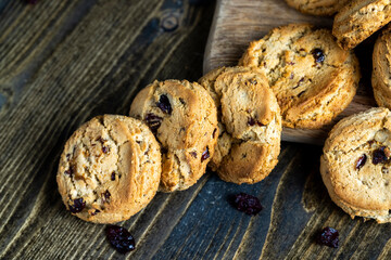 delicious dried cookies made of high-quality flour with dried red cranberries on the table
