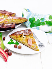 Tart with rhubarb and nut cream on white board