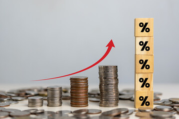 Business finance investments economy stack coin inflation and arrow red with wood cube percentage...