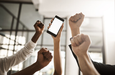 Hands of business people cheering, celebrating good news on a phone with blank screen for copy space. Excited team of office workers showing power fist gesture for success, victory and winning