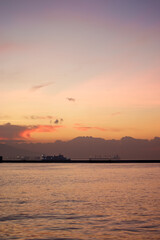 Sunset over the mountains and the coast - bay of Aegean Sea in Izmir, Turkey with copy space
