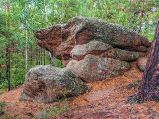 Stones formation in the forest. Erosion of rocks.