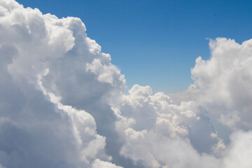Naklejka na ściany i meble Blue sky and clouds background, high angle view