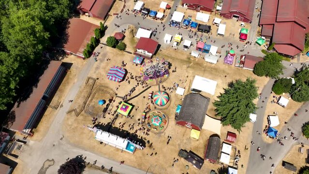Aerial view of an active fairgrounds on a hot summer day in America.