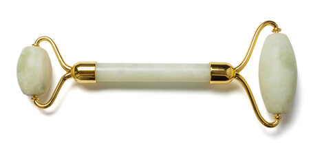 jade roller for facial skin treatment on white background